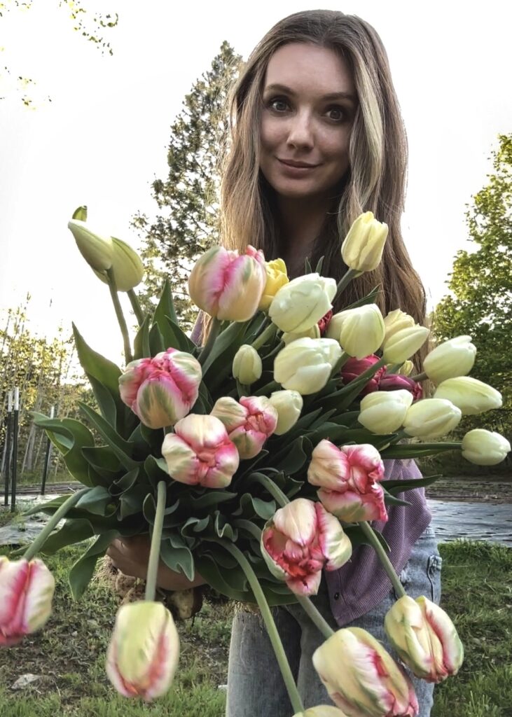 Deanna Williams with arm full of tulips at North Star Farm and Flower